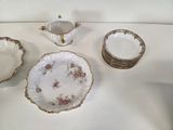 a lot of plates and bowls sitting on a table