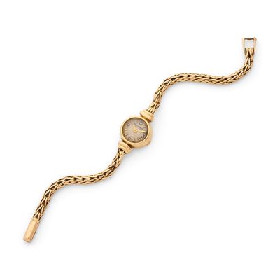 a close up of a gold wrist watch on a white background
