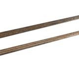 pair of old wooden chopsticks on a white surface with a white background