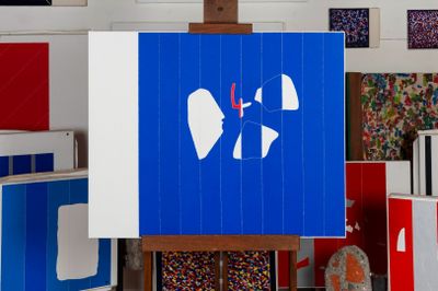 a blue sign with a heart on it in front of a bunch of other signs