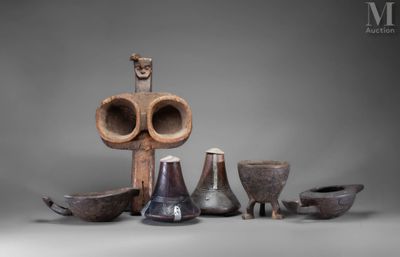 many different types of vases and bowls on the table