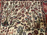 an image of a large oriental rug with a deer and flowers on it
