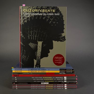 several books stacked on top of each other on a table