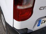 a close up of the tail light of a white truck
