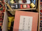 a box full of assorted items sitting on a carpet