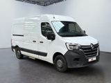 the white van is parked inside of a large white building
