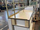a large display case in the middle of a warehouse