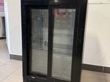 an image of a glass door refrigerator in a store