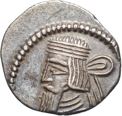 a close up of a silver coin with a crown on it