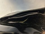 a black purse sitting on top of a table