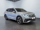 a silver volkswagen suv parked in a white room