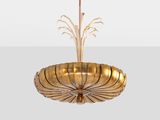 a gold plated chandelier with a glass bowl hanging from the ceiling