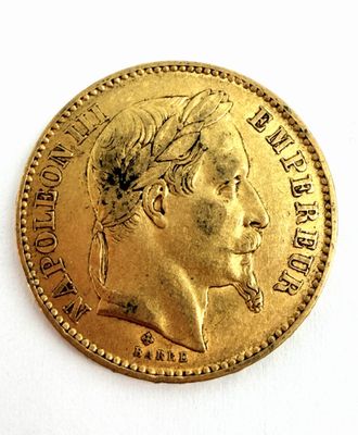 l'image d'une pièce d'or sur laquelle figure le visage d'un homme