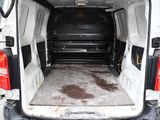 a white van that has a flat bed in the back of it