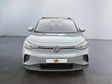 the front view of a silver volkswagen e - golf in a showroom