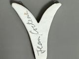 an image of a white letter y with a signature on it