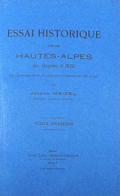 a blue book with black writing on the cover of it