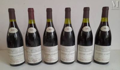 six bottles of wine are lined up in a row on a table
