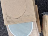 a box with a speaker inside of it on the ground