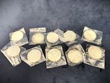 several different types of cookies in plastic bags on a table