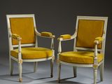 pair of armchairs with yellow velvet upholstered seats