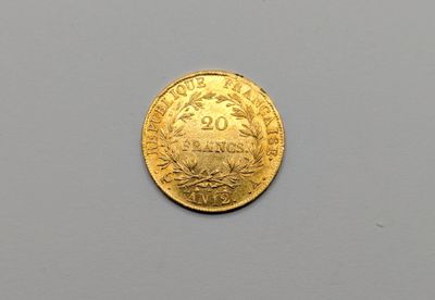 une image représentant une pièce d'or sur laquelle figure le chiffre vingt