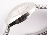 a close up of a watch with a chain around it