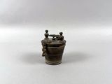 an image of a small metal object on a white surface