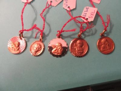 many different types of medals on a blue table