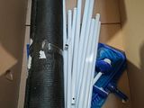 a cardboard box with a roll of tape and a pair of scissors in it