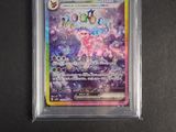 a close up of a pokemon card in a plastic case