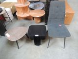 many different chairs and tables in a room