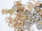 many different types of jewelry on a white surface