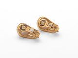 pair of yellow gold earrings with mother and child ' s faces