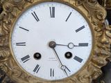 a clock that is sitting on top of a table
