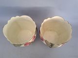 two bowls that are sitting next to each other on a table