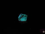 a blue diamond on a black background