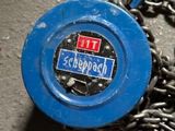 a blue chain with a red and blue sign on it