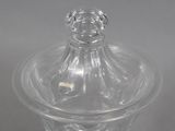 clear glass jar with a lid on a white surface