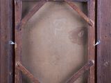 an old wooden picture frame with a picture of a cat in it