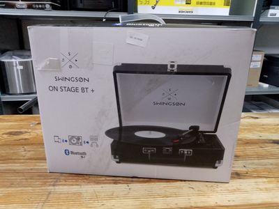 a box with a record player inside of it on a table