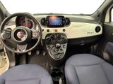 the interior of a small car with blue seats and dashboard
