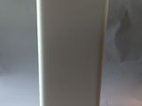 a white vase that is sitting on a table