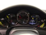 a close up of a car dashboard with various gauges