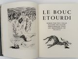 an open book with a drawing of a man and a dog on it