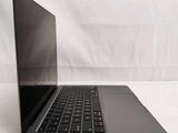 an open laptop computer sitting on top of a white surface