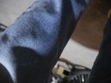 a close up view of a person ' s feet with a cell phone in their hand