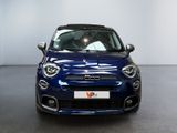 the front view of a blue fiat car parked in a showroom