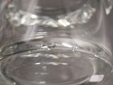 a close up of a clear glass pitcher on a table