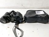 a black bag and a pair of binoculars sitting on a table